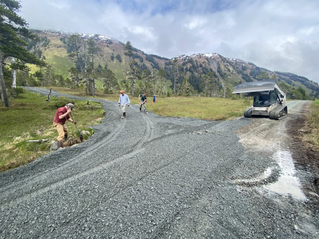 Nordic Trails, volunteer workers and bobcat.